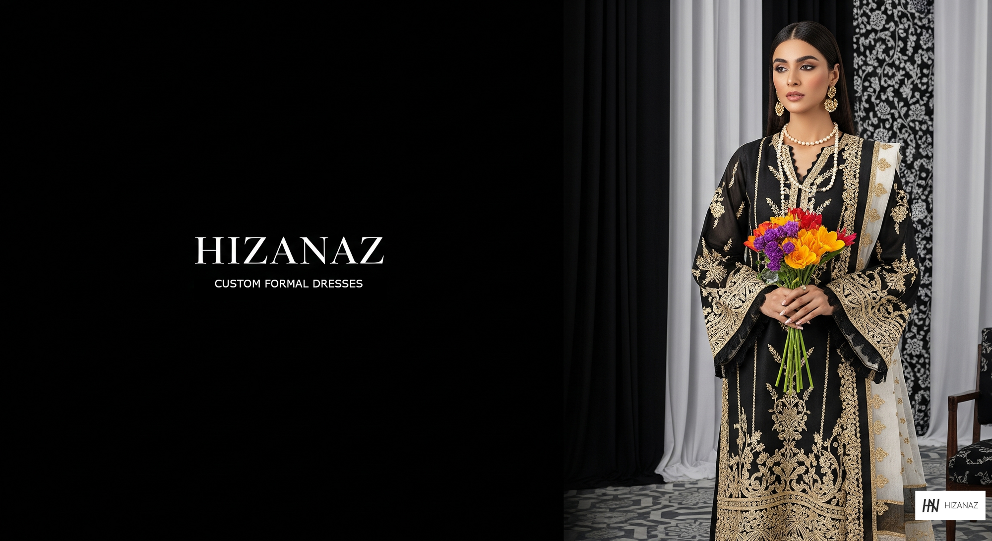 Woman in a black and gold embroidered dress holding flowers, with 'Hizanaz' branding.